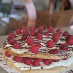 Hazelnut and raspberry meringue cake