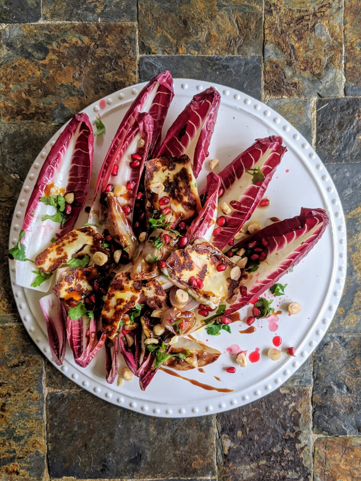 Pan fried halloumi with radicchio jerusalem artichoke and pomegranate