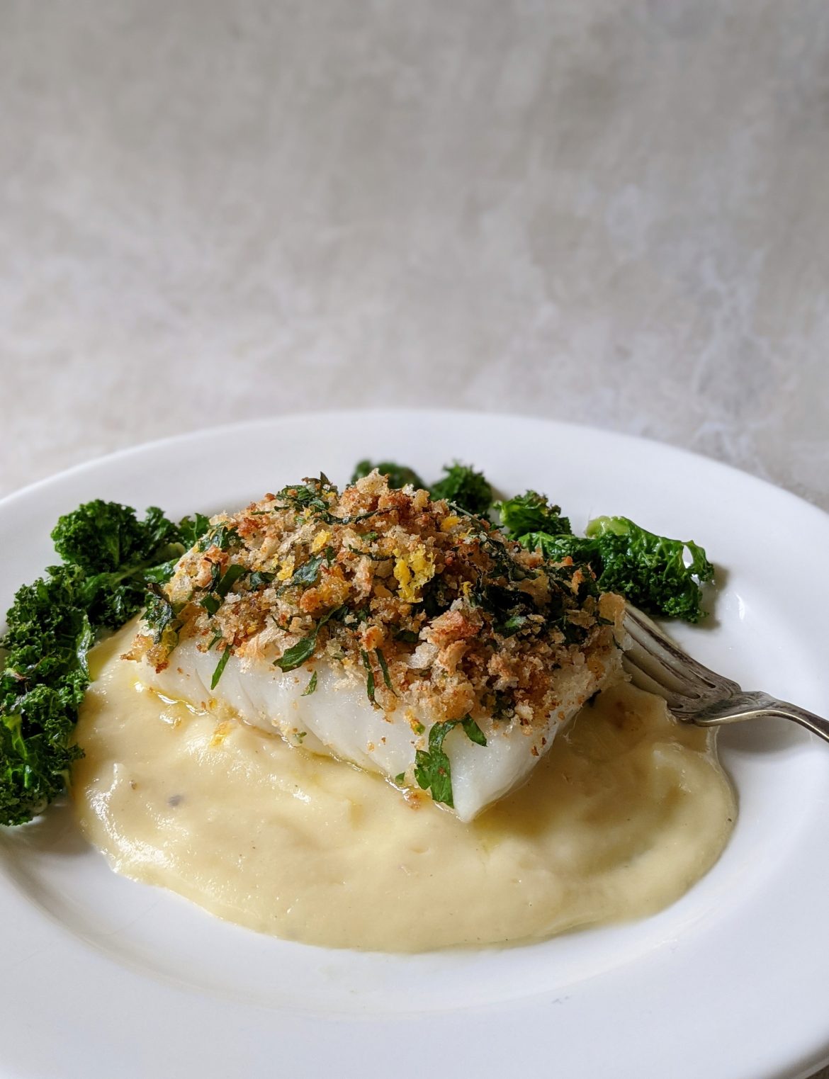 PXL_20210121_131533063.PORTRAIT~2 Roast Cod with Parsley breadcrumbs on celeriac mash with crispy kale